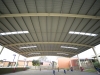 Curved roof steel building school court cover with padded safety posts - Melbourne, Victoria